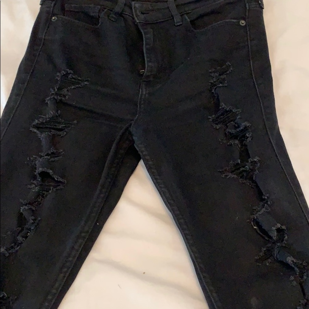 Super distressed black jeans